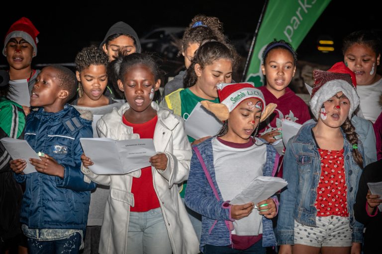 Group of young children singing in a choir by Katja Photography