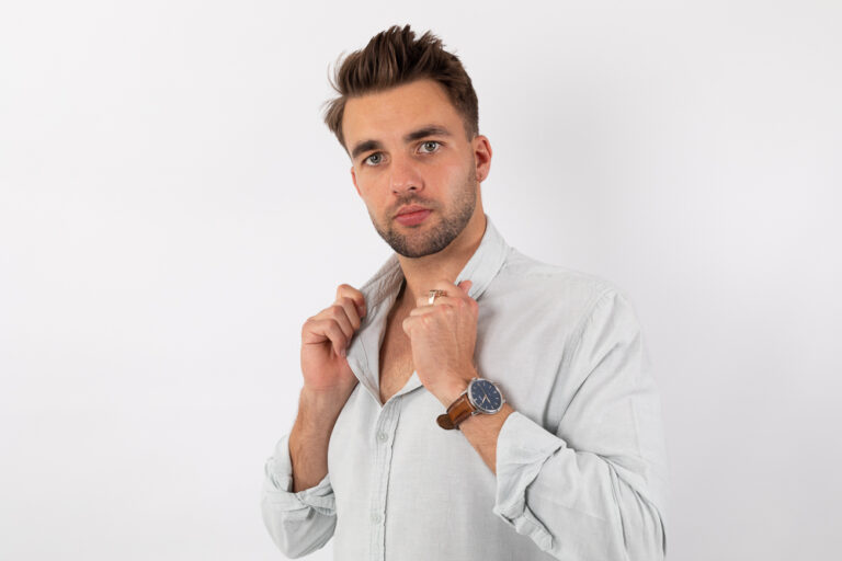Studio portrait of a young man in a casual cream-colored shirt by Katja Photography