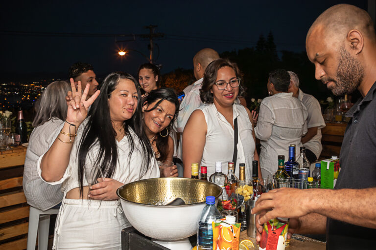 Nighttime image of a group of party people by Katja Photography