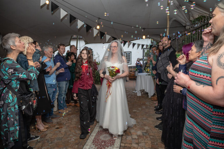 Bride walking down the aisle by Katja Photography